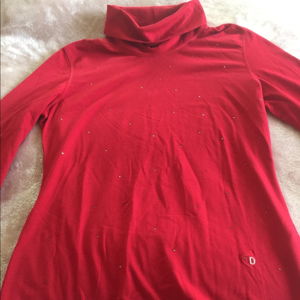 Beautiful woman’s red turtleneck by Dismero.